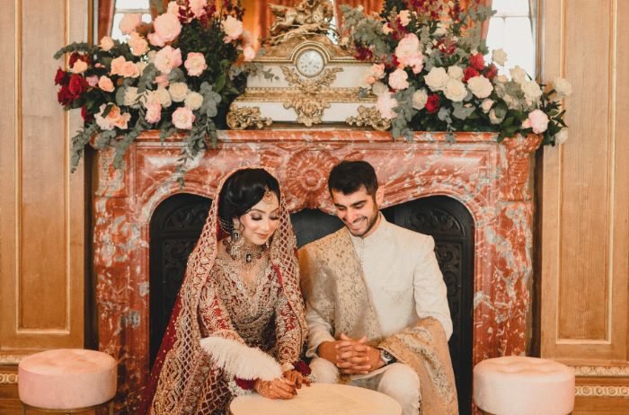A couple sat beside the fireplace in the Banqueting Room. 