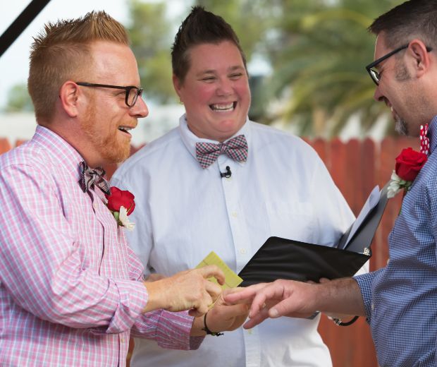 Two men exchanging rings. 