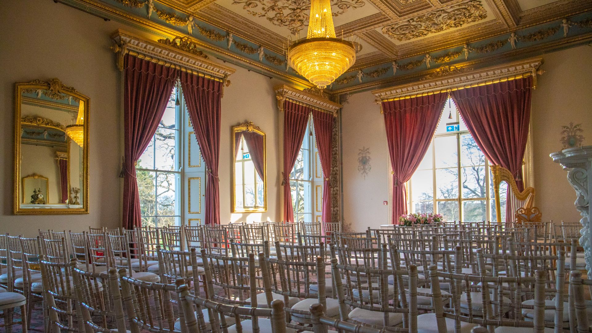 The Drawing Room featuring an intricate ceiling set up for a wedding ceremony. 